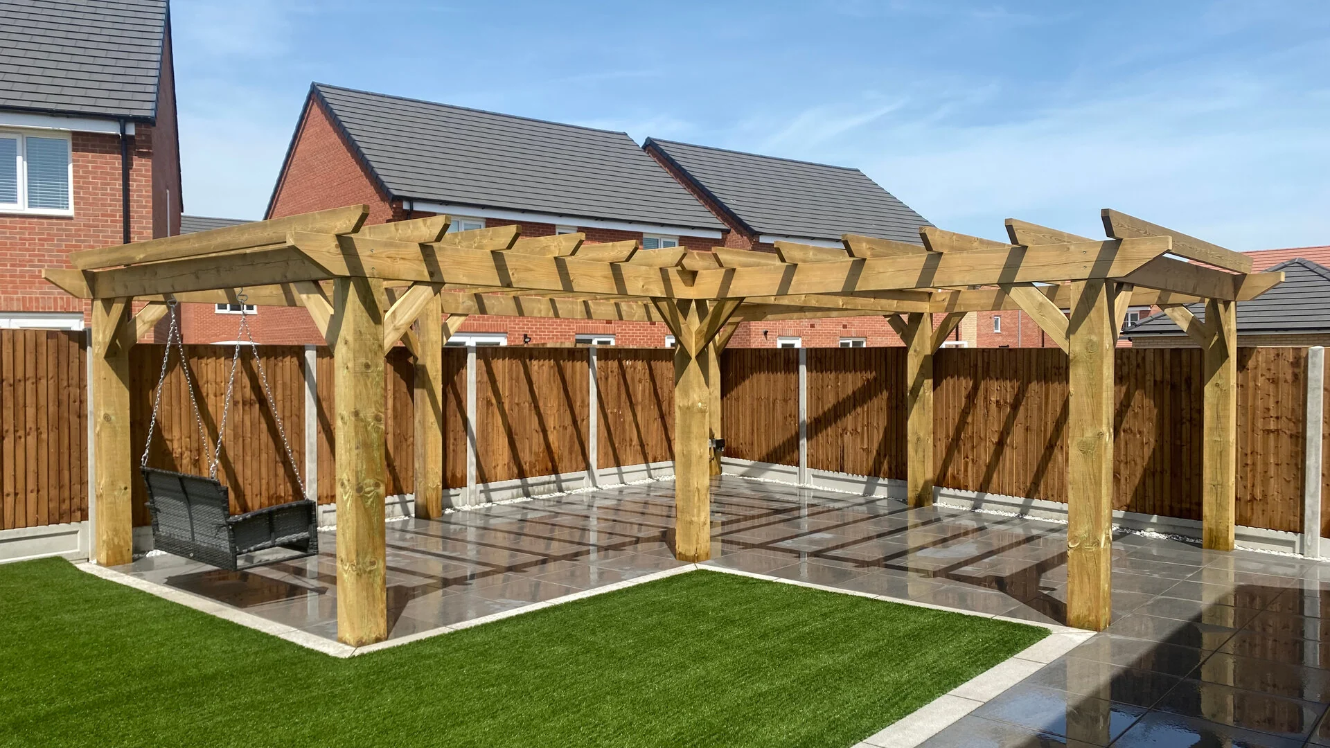 Beautiful garden with artificial grass and porcelain paving installation in Norwich by AGPSN