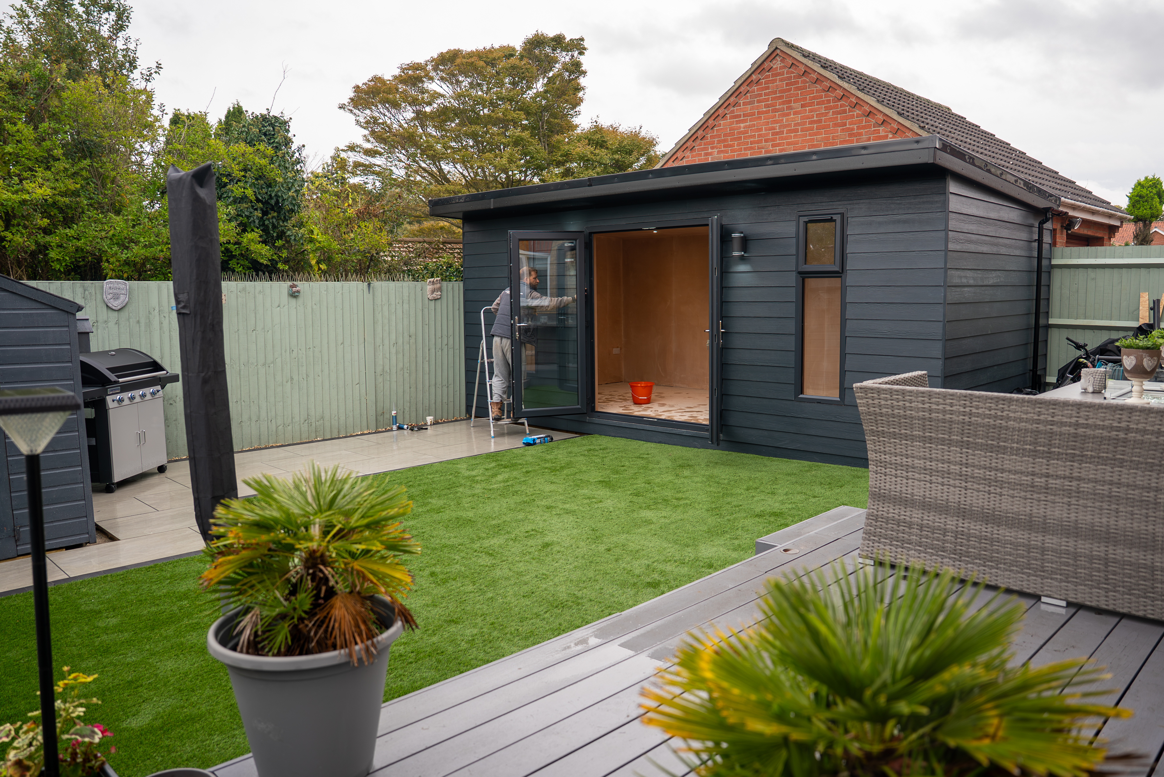 Garden room with artificial grass and decking Norwich